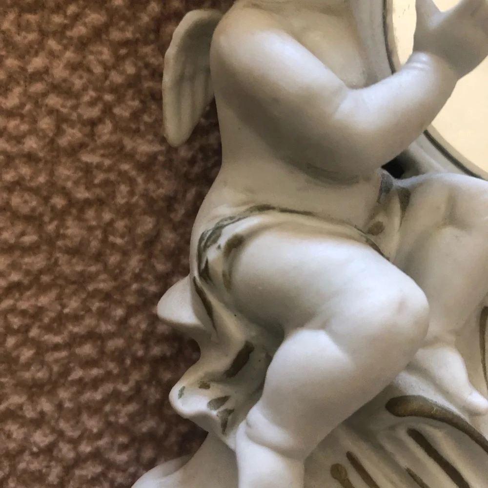 White Cherub Accent Mirror with Floral Motif And Bisque Two White Roses